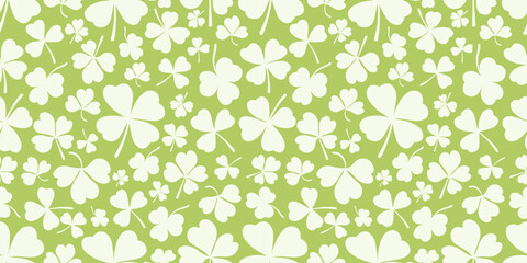 Shamrock or clover leaf horizontal green seamless pattern falling leaves on white background vector illustration. Irish holiday celtic St Patrick day motif seamless pattern with shamrock clover leaf.