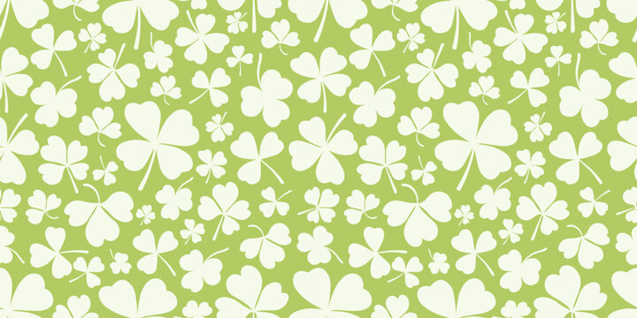 Shamrock or clover leaf horizontal green seamless pattern falling leaves on white background vector illustration. Irish holiday celtic St Patrick day motif seamless pattern with shamrock clover leaf.