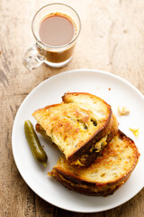 Grilled tuna and cheese sandwiches on sourdough bread.
