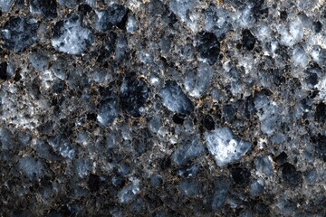 Dark, textured stone surface with embedded crystals