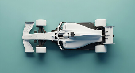 Overhead view of a sleek white modern formula 1 race car model on a muted teal surface in studio lighting