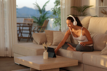 Yogi preparing online yoga class on tablet in a house