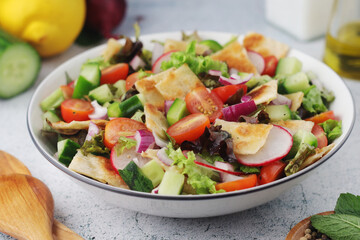 A bowl with Fattoush - Traditional Levantine salad	