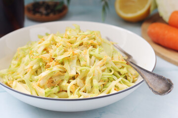 A bowl with coleslow salad	