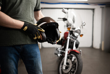 Man Holding Protective Moto Helmet