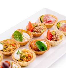 Colorful bite-sized appetizers arranged neatly on a serving platter