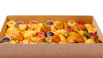 Assorted pastries and desserts arranged in a charming display box