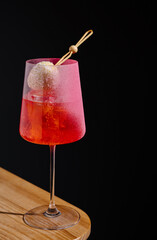 Refreshing cocktail served in a stylish glass on a wooden surface