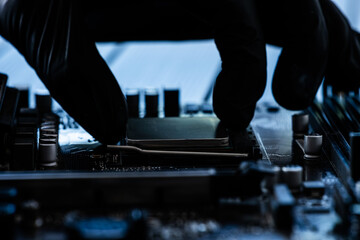 Serviceman Installing Main Processor Chip On Motherboard