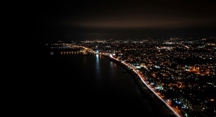 Fototapeta premium Coastal City Nightscape Aerial View of Illuminated Waterfront