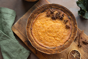 Pumpkin pie garnished with anise. Homemade traditional American thanksgiving pie, top view