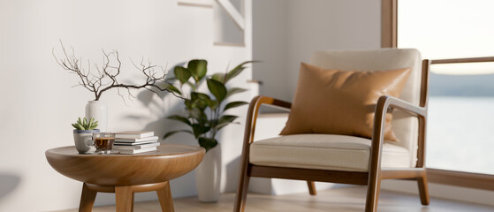 Wooden armchair and side table beside white wall and staircase in a modern house or office building.