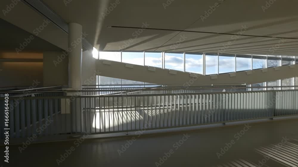 Poster sunlight passing through modern building windows creates moving shadows