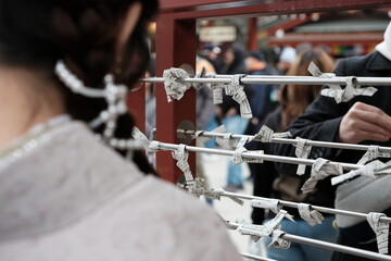 Draw a fortune slip "Omikuji" in Asakusa Kannon, Japanese Buddhist Temple