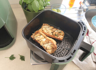 Bruschetta with porcini mushrooms and cheese. Food and quality products cooked in aero fryer. Traditional cuisine of Italy.