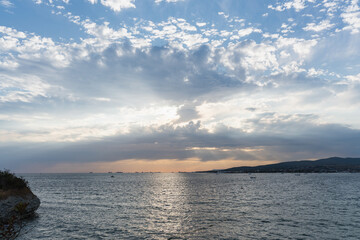Scenic sunset over the sea with dramatic sky.
