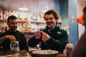 A cheerful group of friends is engaged in food preparation in a warm and inviting lounge bar atmosphere, fostering camaraderie.