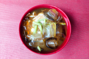 Mixed Fruit Ice in a black bowl on the table