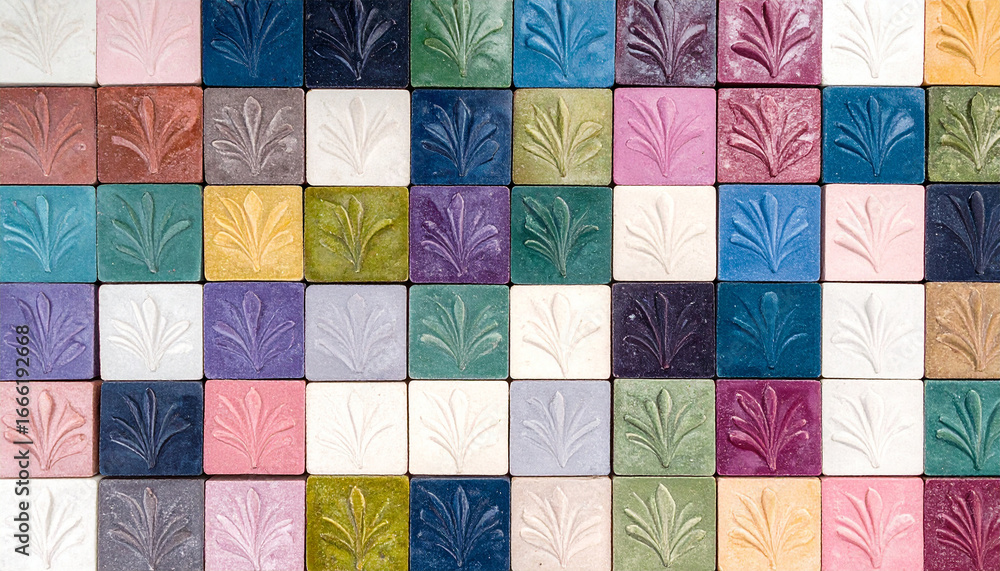 Poster colorful tile display: a vibrant array of square tiles, each adorned with a delicate leaf pattern in