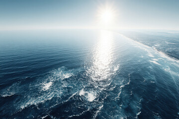 capture breathtaking aerial view of pristine ocean waters showcasing bright sunlight reflections