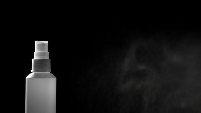 Spray bottle mist stream on black background effect for cleaning product or cosmetic design