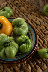 Freshly harvested heirloom tomatoes arranged on a rustic table with vibrant colors and textures