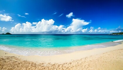 Fototapeta premium Beautiful beach with white sand, turquoise ocean water and blue sky with clouds in sunny day.jpg
