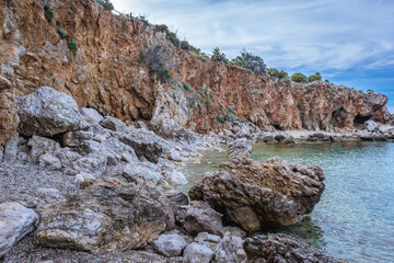 Rocsky shore of so called Disa beach in Zingaro park, oldest nature reserve on Sicily Island in...