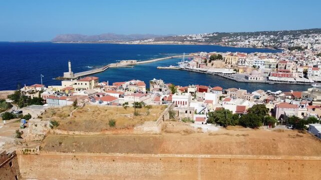 Panoramic aerial view of old Venetian harbor of Chania in create with lighthouse in view, Mediterranean sea