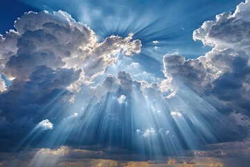 Sunlight piercing through dramatic clouds