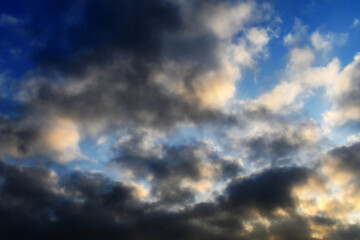 Dramatic dark cloud in sunny day cumulus white clouds with blue sky. Cloudscape summer tropical background.