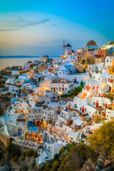 lights of Oia village at blue night lose up, Santorini Greece