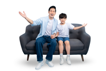 A father and son happily sitting on a couch, arms outstretched in excitement. They both look happy and healthy on a PNG background