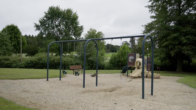 A playground in an empty park. Cloudy day.