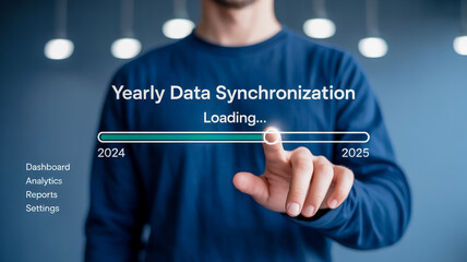 Man s finger interacting with a digital yearly data synchronization loading bar progress indicator