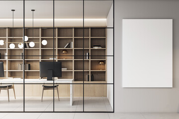 Modern corporate office interior with sleek furniture, bookshelves, and a vertical blank canvas...