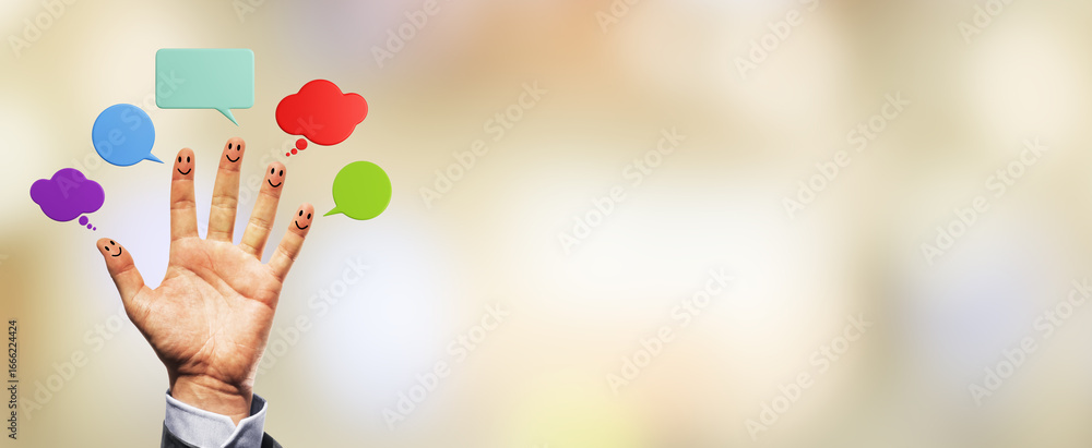 Poster hand with smiley faces on fingers and colorful speech bubbles on a soft light background representin