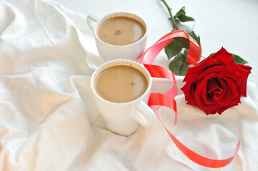 Fresh aromatic coffee in bed. Coffee for two.
