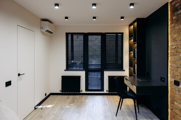 Modern Minimalist Home Office Design Featuring a Beautiful Desk and Chic, Stylish Decor Accents