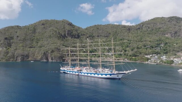 Aerial view of a majestic tall ship sailing on the calm, deep blue ocean waters, creating a striking contrast against the sky, Le Pitons, Soufri&egrave;re, Saint Lucia.