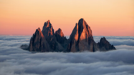 Majestic mountain peaks above clouds at golden sunrise, cinematic atmosphere, ultra-detailed landscape