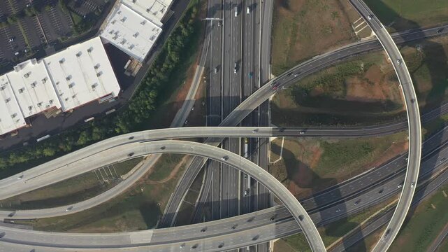 Aerial view of roads intersecting with buildings, cars and trucks creating a network of transport in Greenville, South Carolina, United States.