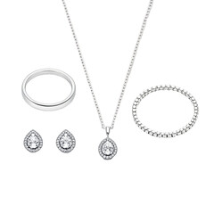 Elegant Diamond Jewelry Set Featuring Necklace Bracelet Earrings and Ring Against a Dark Background Perfect for Wedding Engagement or Anniversary Gift Presentation