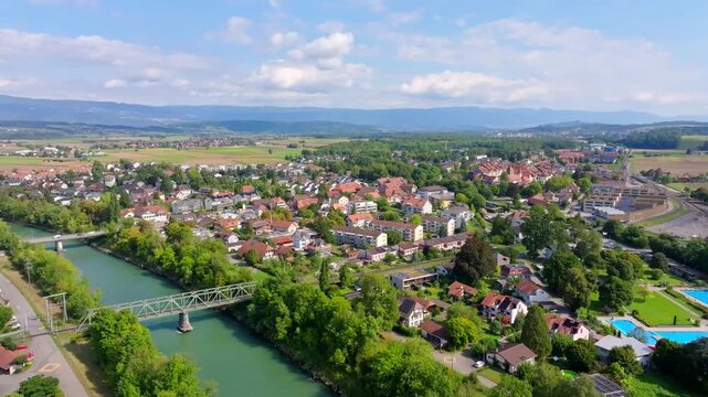 Aerial view of buildings and trees, a blend of urban and natural textures, under a sky, Aarberg, Canton of Bern, Switzerland.
