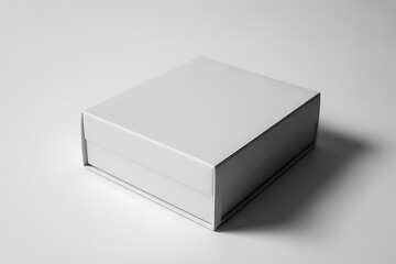Naklejka premium Simple plain white rectangular box displayed in a studio with subtle shadow