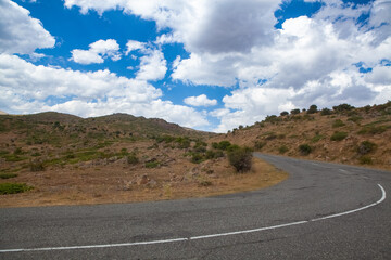 asphalt road in the middle of a desert