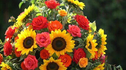 Floral arrangement with sunflowers and roses in vibrant colors - Powered by Adobe