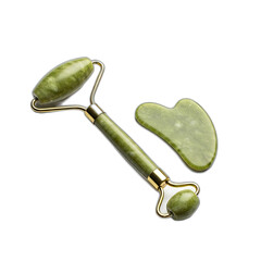 Close up shot of a jade roller and gua sha tool on a transparent background for skincare routine