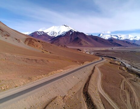 Mountain road winding through a desert landscape