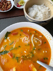 Steaming Peruvian chupe de camarones, vibrant seafood symphony, a culinary tango celebrating Pachamama rituals and marine diversity festival